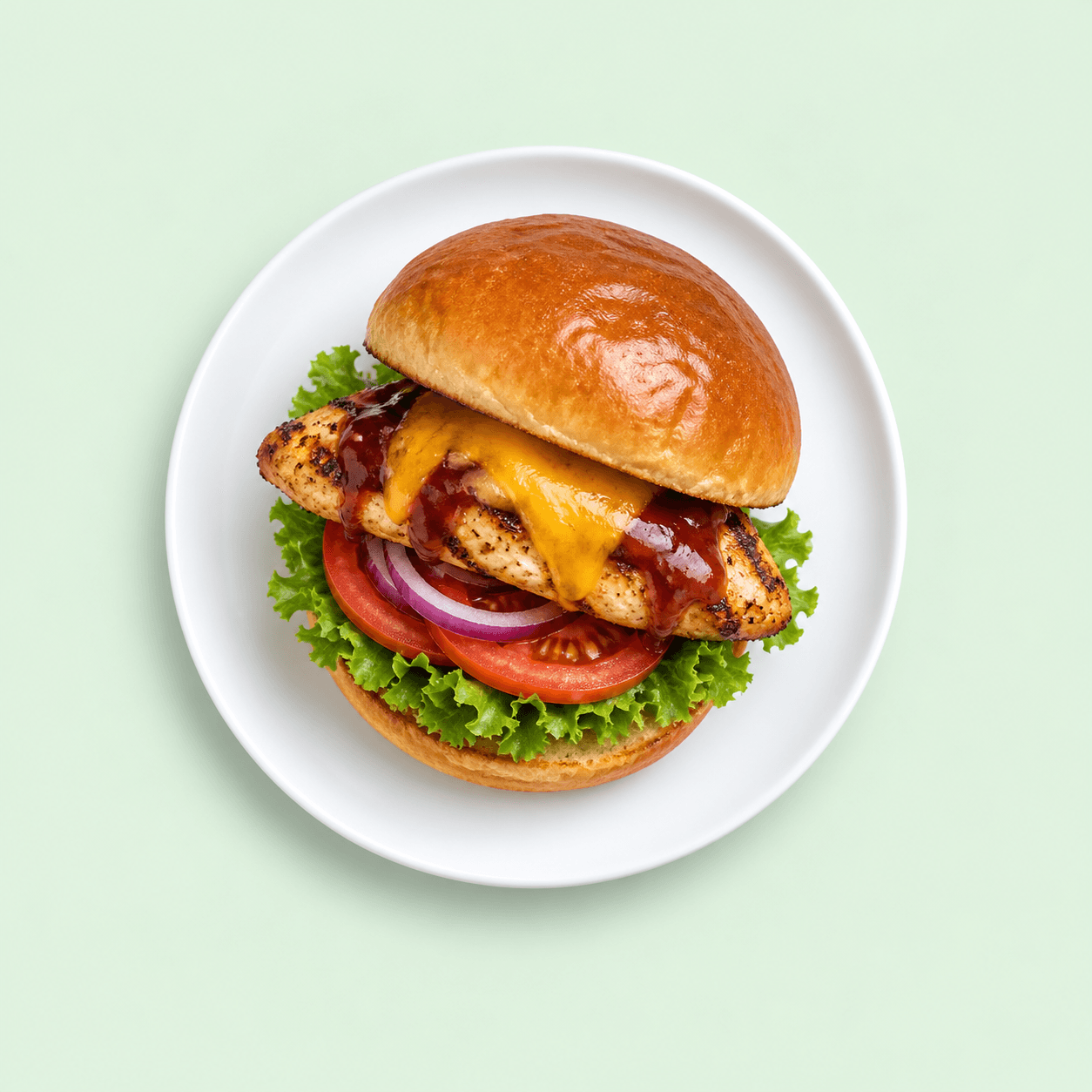 BBQ chicken burger with cheese and fresh salad